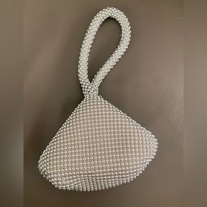 Wristlet bag. Light silver beaded.